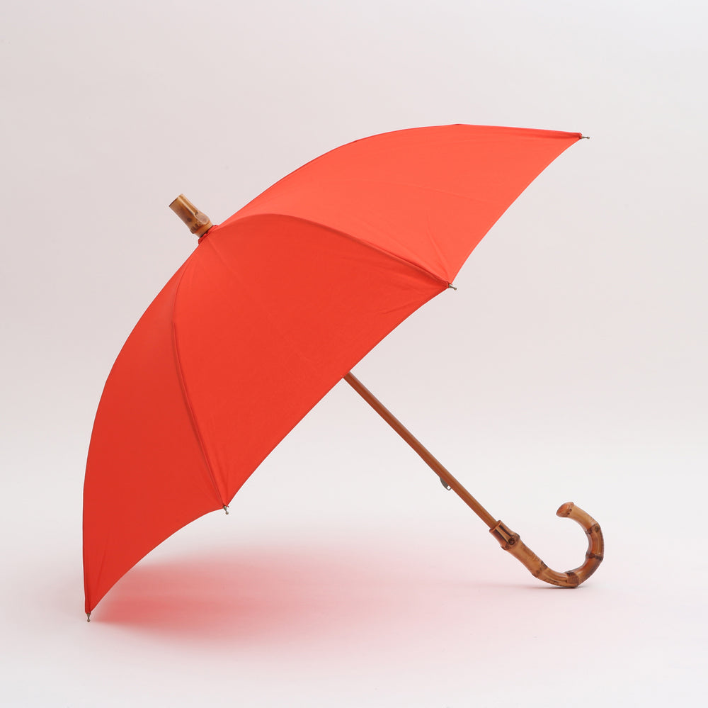 ブランドを代表するアイテム折りたたみ傘。撥水加工とUV加工を施して晴雨兼用としてお使い頂けます。  マテリアル：綿100％　原産国：日本